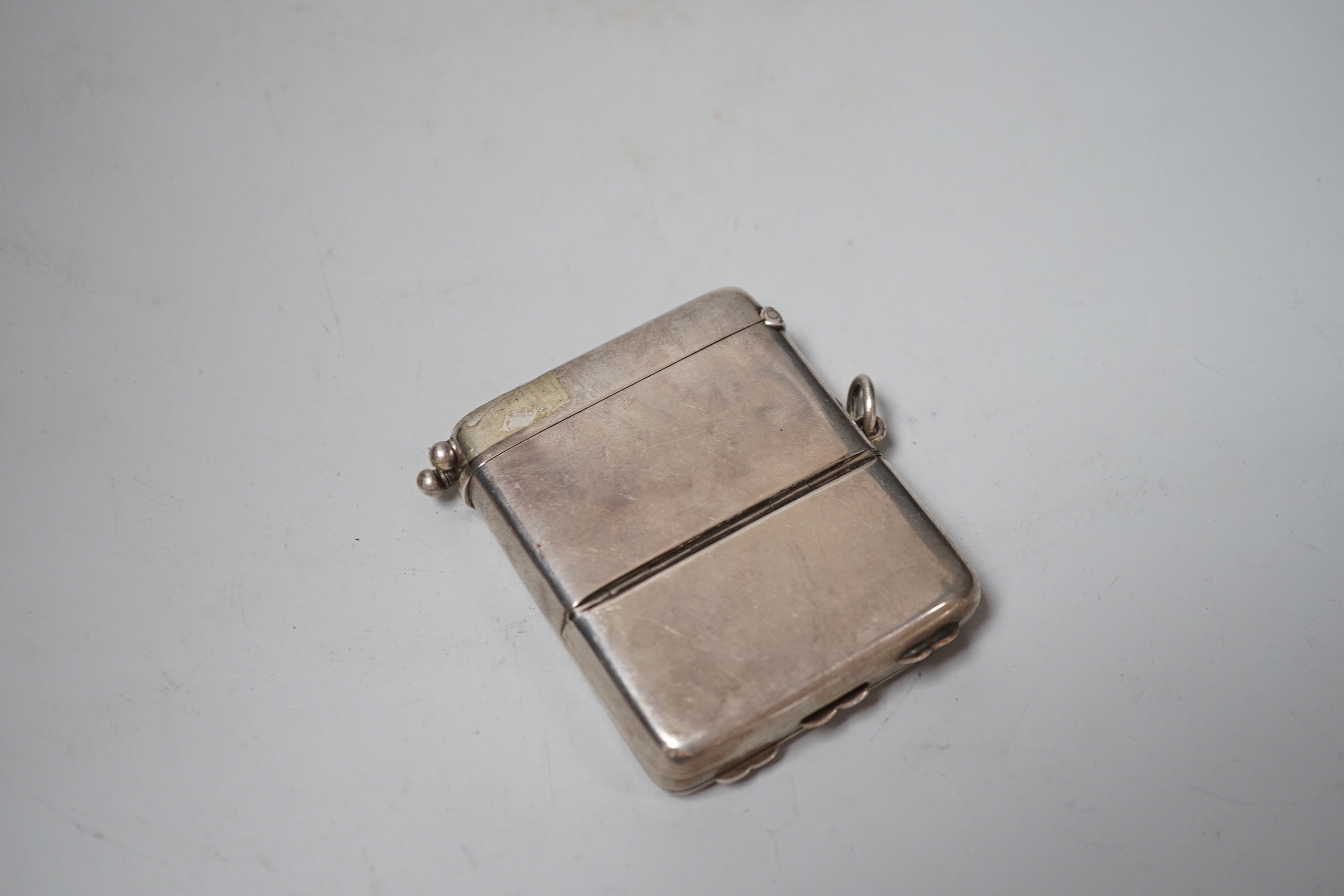 An Edwardian silver combination calling card, sovereign, vesta and pencil holder case, William Neale & Sons, Chester, 1904, 76mm.
